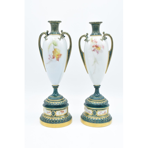 52 - Royal Worcester pair of twin-handled floral vases 1957 (unsigned) (27cm tall) One has been restored ... 