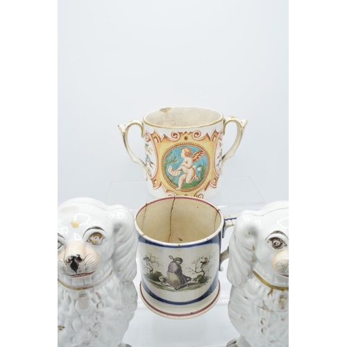 58 - 19th century Staffordshire pottery to include a pair of dogs, a shepherd mug and a 2 handled cherub ... 