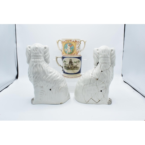 58 - 19th century Staffordshire pottery to include a pair of dogs, a shepherd mug and a 2 handled cherub ... 