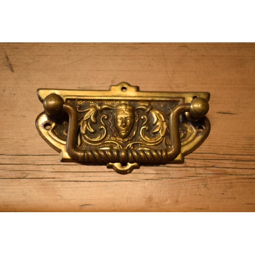 97 - A collection of Edwardian cast brass furniture handles (13) Each one measures 9x5cm. In good conditi... 