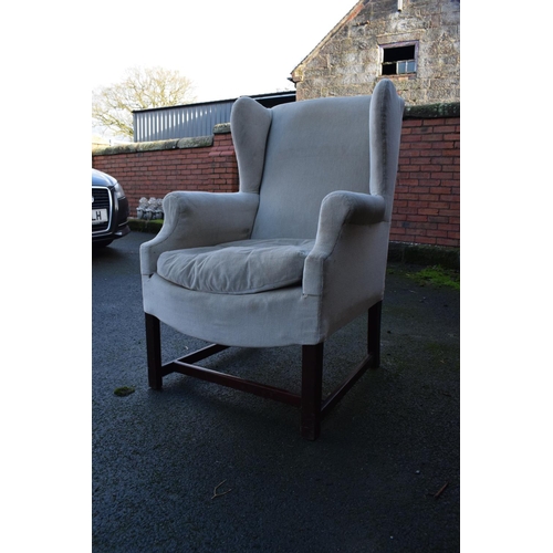 327 - George III style wingback mahogany arm chair. In good condition with age related wear as expected. C... 