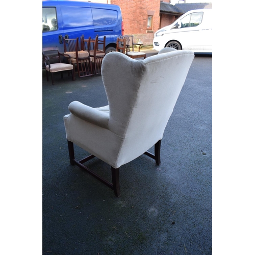 327 - George III style wingback mahogany arm chair. In good condition with age related wear as expected. C... 