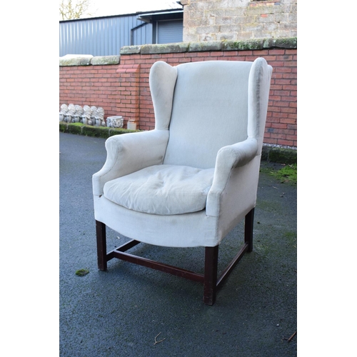 327 - George III style wingback mahogany arm chair. In good condition with age related wear as expected. C... 