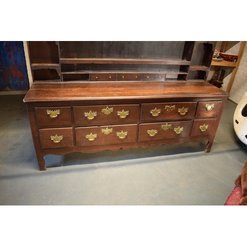 294 - Georgian large oak dresser with spice drawers: 4 draws wide. All original brass handles. Some damage... 