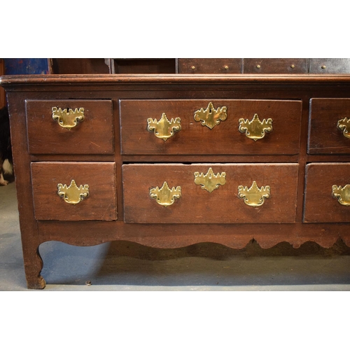 294 - Georgian large oak dresser with spice drawers: 4 draws wide. All original brass handles. Some damage... 