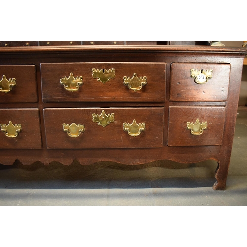 294 - Georgian large oak dresser with spice drawers: 4 draws wide. All original brass handles. Some damage... 