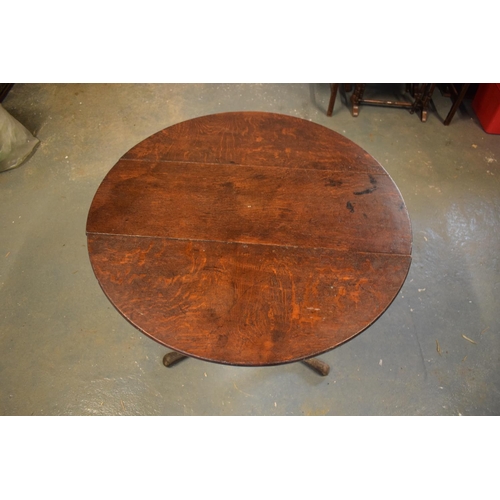 308 - Victorian oak circular tilt top table. Signs of old worm and usage, still functional. 81cm diameter,... 