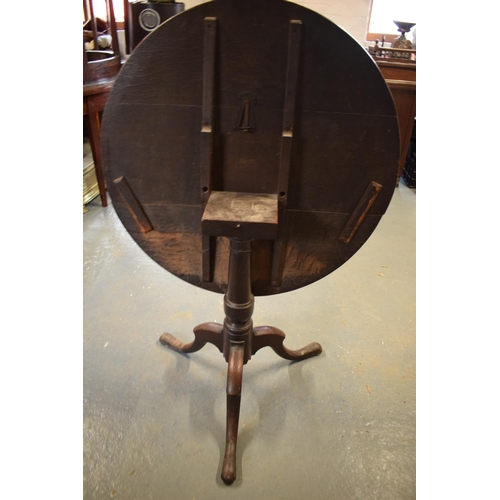 308 - Victorian oak circular tilt top table. Signs of old worm and usage, still functional. 81cm diameter,... 