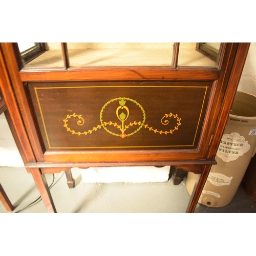 310 - Edwardian inlaid mahogany and glass display cabinet. There is a crack to one leg. worm is apparent, ... 