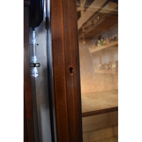 311 - Edwardian inlaid mahogany and glass display cabinet. In good functional condition with signs of wear... 