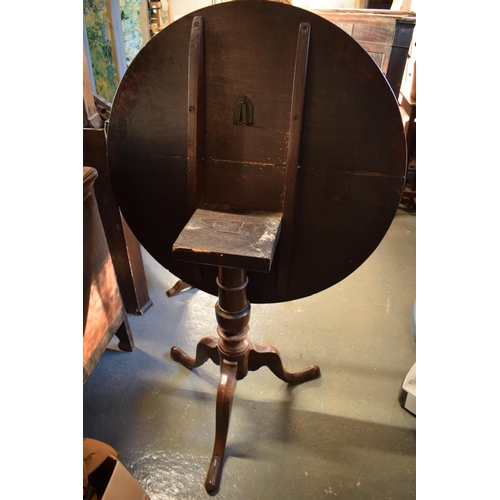 312 - Victorian oak circular drop leaf table. One plank has been reglued on the top. Repair to the block t... 