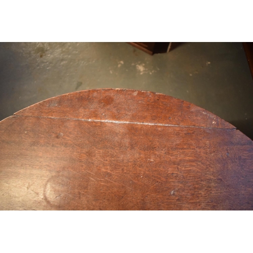 312 - Victorian oak circular drop leaf table. One plank has been reglued on the top. Repair to the block t... 