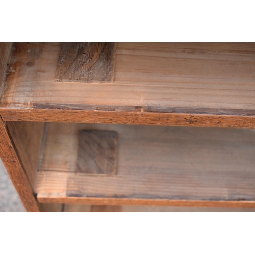 317 - Edwardian oak chest of drawers on caster wheels. There some splits to the wood and sections of missi... 