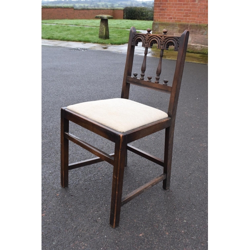 321 - Ercol elm dining table together with 6 matching chairs in a colonial style. Generally in good condit... 