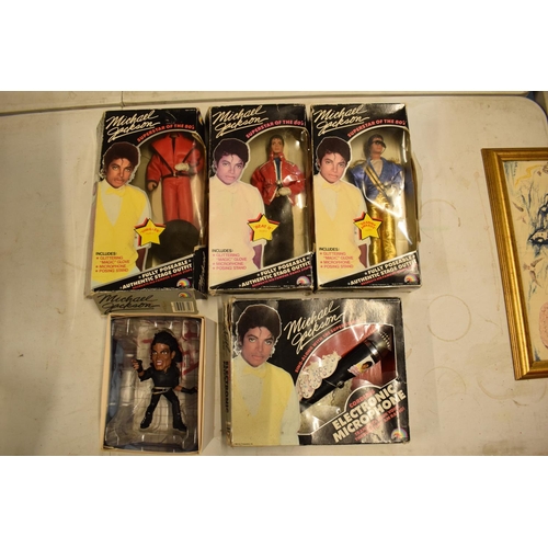 5W - A collection Michael Jackson figures and toys to include 'BAD' figure, electronic microphone and Sup... 