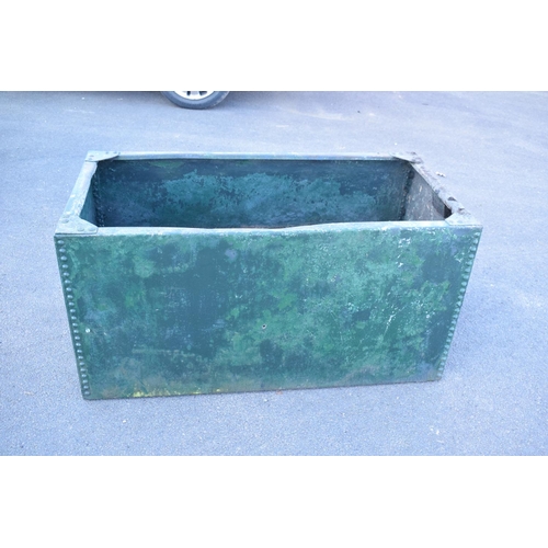 339 - Early 20th studded metal water trough which has been previously used as a planter. There have been h... 