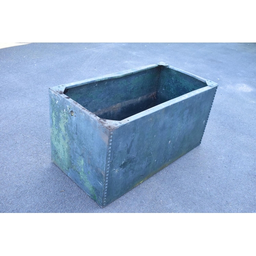 339 - Early 20th studded metal water trough which has been previously used as a planter. There have been h... 