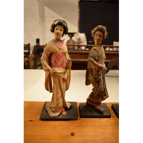 108 - A collection of 20th Japanese silk faced Geisha dolls (5). The dolls are I need of attention as they... 