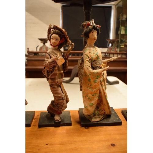 108 - A collection of 20th Japanese silk faced Geisha dolls (5). The dolls are I need of attention as they... 