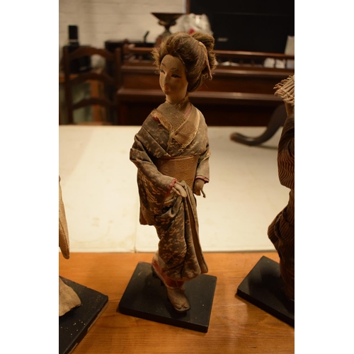 108 - A collection of 20th Japanese silk faced Geisha dolls (5). The dolls are I need of attention as they... 