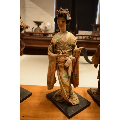 108 - A collection of 20th Japanese silk faced Geisha dolls (5). The dolls are I need of attention as they... 