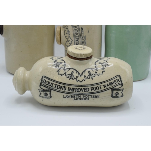 11 - A collection of stoneware foot warmers to include 2 Doulton (4) The stoneware's condition is as expe... 