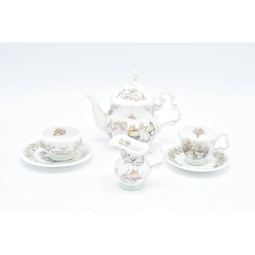 122 - Royal Doulton miniature Brambly Hedge tea set to include tea pot, milk, sugar, plate an a do (6) In ... 