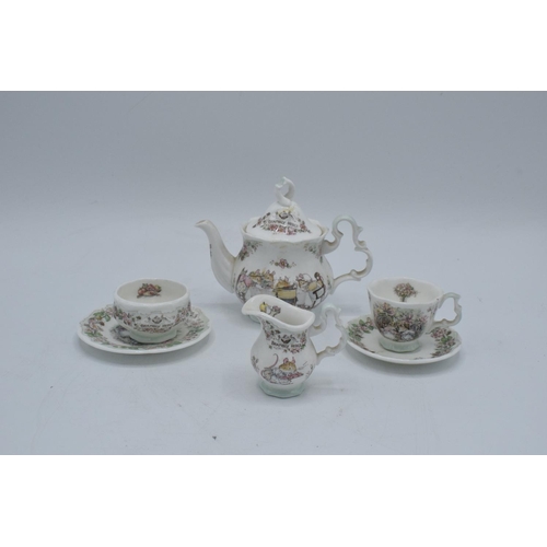 122 - Royal Doulton miniature Brambly Hedge tea set to include tea pot, milk, sugar, plate an a do (6) In ... 