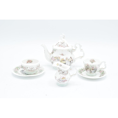 122 - Royal Doulton miniature Brambly Hedge tea set to include tea pot, milk, sugar, plate an a do (6) In ... 