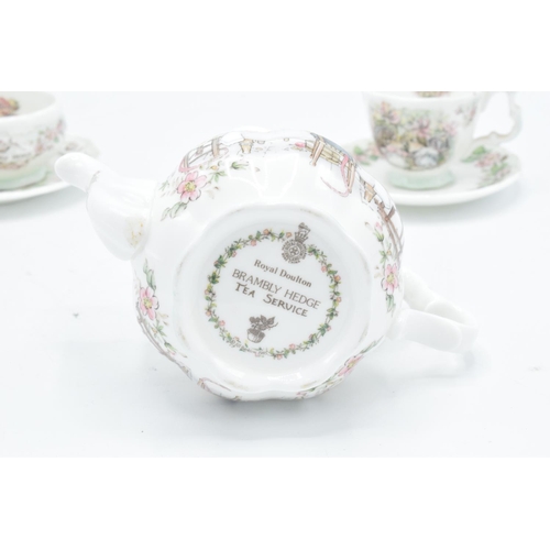 122 - Royal Doulton miniature Brambly Hedge tea set to include tea pot, milk, sugar, plate an a do (6) In ... 