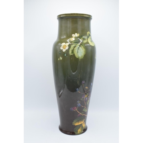 129 - Doulton Lambeth Faience vase with a floral design, initialled MW- Minnie Webb, 48cm tall. The item h... 