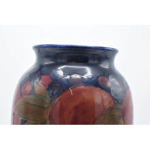 130A - Moorcroft tall tubular vase in the Pomegranate design. There has been some professional restoration ... 