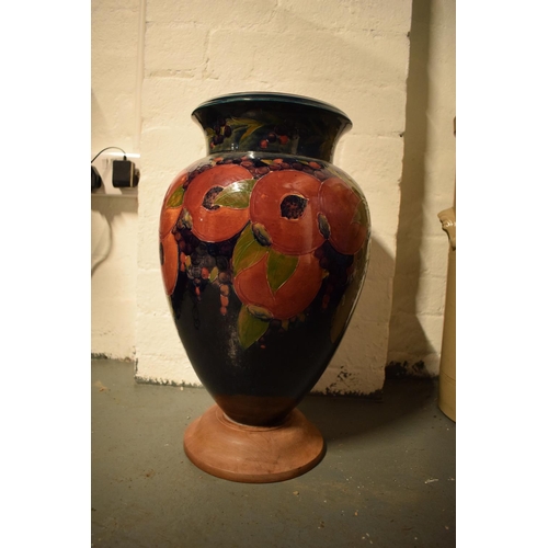 130B - Impressive Moorcroft bulbous vase in the Pomegranate design mounted on a newer wooden base. Standing... 