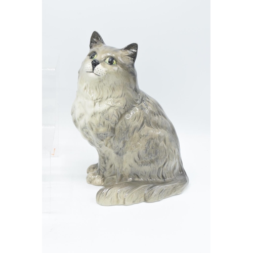 150 - A collection of Beswick cats to include 1030 smokey grey, grey 1807, white 898 and a Royal Doulton s... 