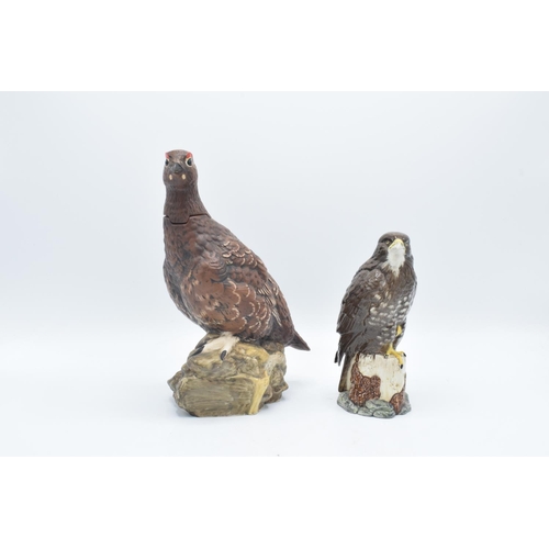 151 - Royal Doulton buzzard whiskey decanter and The Famous Grouse decanter (2) In good condition without ... 