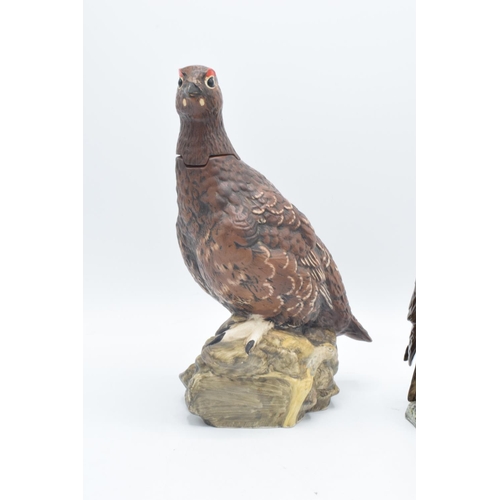 151 - Royal Doulton buzzard whiskey decanter and The Famous Grouse decanter (2) In good condition without ... 