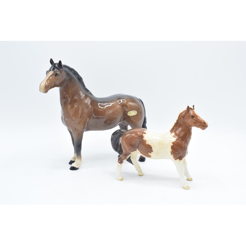 152 - Beswick brown Welsh Cob  1793 and skewbald girls pony 1483 (a/f) (2) In good condition without any o... 