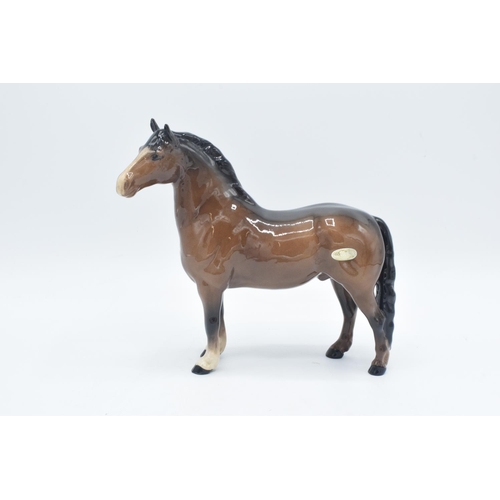 152 - Beswick brown Welsh Cob  1793 and skewbald girls pony 1483 (a/f) (2) In good condition without any o... 