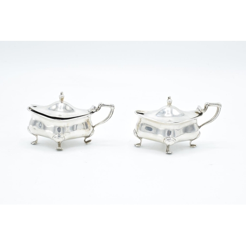 202 - Pair of silver mustard/ condiment pots with blue liners, hallmarked for Birmingham 1913, made by Hen... 