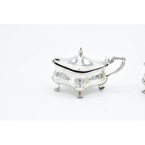 202 - Pair of silver mustard/ condiment pots with blue liners, hallmarked for Birmingham 1913, made by Hen... 