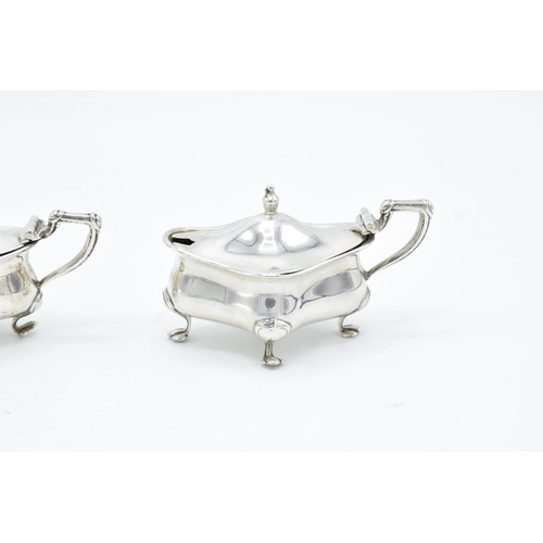 202 - Pair of silver mustard/ condiment pots with blue liners, hallmarked for Birmingham 1913, made by Hen... 