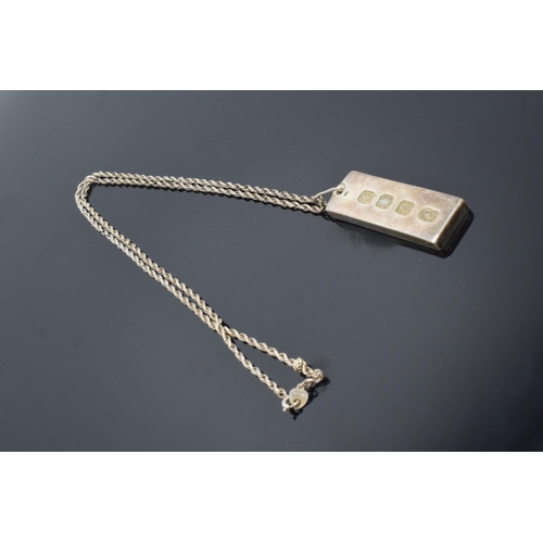 208 - Silver ingot pendant on silver chain, hallmarked for Edinburgh 1977 (34.5 grams)