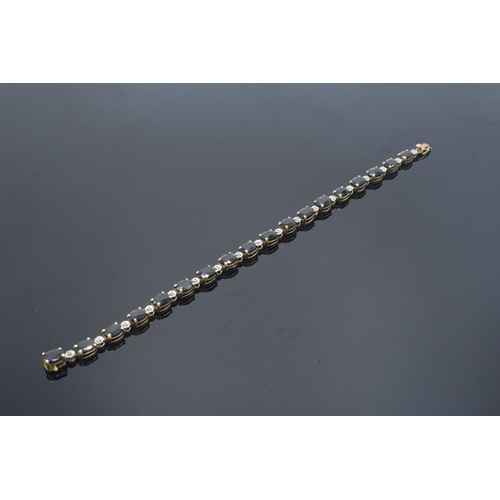 217 - 10k gold coloured metal sapphire & diamond bracelet: Tested as solid 9ct gold or better, set with 18... 