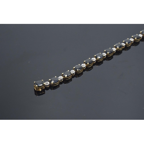 217 - 10k gold coloured metal sapphire & diamond bracelet: Tested as solid 9ct gold or better, set with 18... 