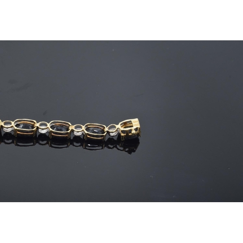 217 - 10k gold coloured metal sapphire & diamond bracelet: Tested as solid 9ct gold or better, set with 18... 