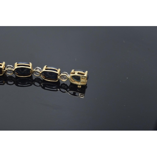 217 - 10k gold coloured metal sapphire & diamond bracelet: Tested as solid 9ct gold or better, set with 18... 