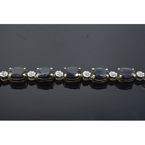 217 - 10k gold coloured metal sapphire & diamond bracelet: Tested as solid 9ct gold or better, set with 18... 