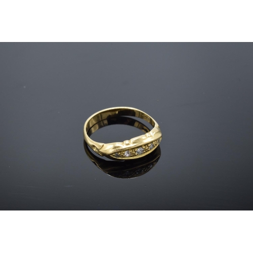 223 - 18ct gold ring with 5 illusion set diamonds, stamped 18ct. 1.9 grams total weight.