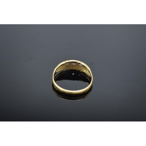 223 - 18ct gold ring with 5 illusion set diamonds, stamped 18ct. 1.9 grams total weight.