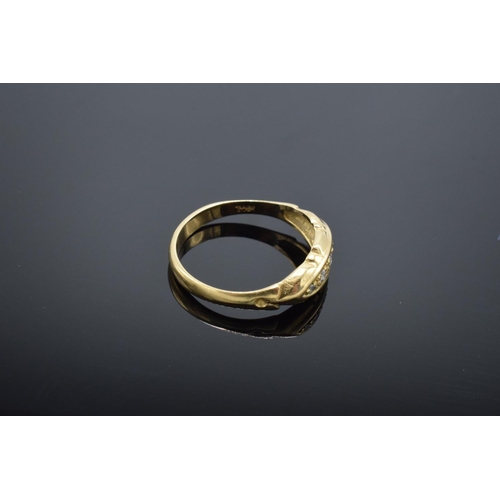 223 - 18ct gold ring with 5 illusion set diamonds, stamped 18ct. 1.9 grams total weight.